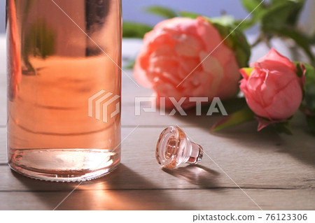 Bottle Of Pink Rose Wine and Spring Flowers 76123306