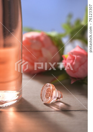 Bottle Of Pink Rose Wine and Spring Flowers 76123307
