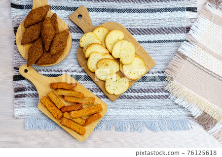 Homemade croutons close-up of dry bread crackers. use of products. for no waste Homemade croutons close-up of dry bread crackers. use of products. for no waste 76125618