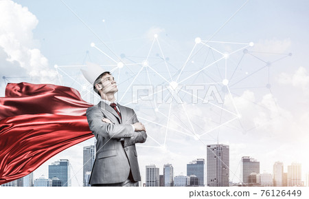Concept of power and sucess with businessman superhero in big ci Concept of power and sucess with businessman superhero in big ci 76126449