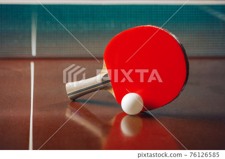 table tennis racket and ball, net background table tennis racket and ball, net background 76126585