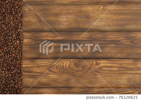 Coffee beans on wooden background. Copy space. Flat lay Coffee beans on wooden background. Copy space. Flat lay 76126625