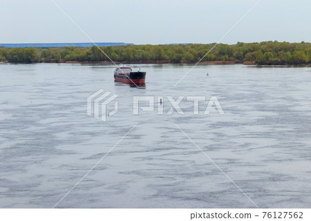 Cargo ship sailing on the river Dnieper 76127562