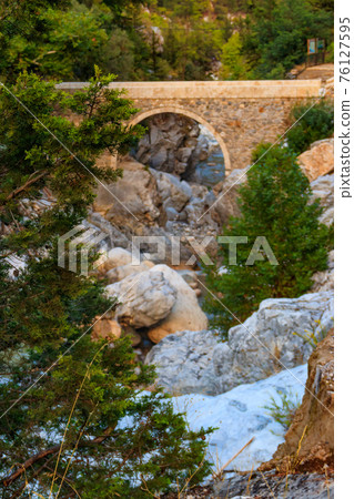 Ancient stone bridge across a mountain river in Kesme Bogaz canyon, Antalya province in Turkey Ancient stone bridge across a mountain river in Kesme Bogaz canyon, Antalya province in Turkey 76127595