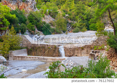 Small waterfall on mountain river in Kesme Bogaz canyon, Antalya province in Turkey 76127602