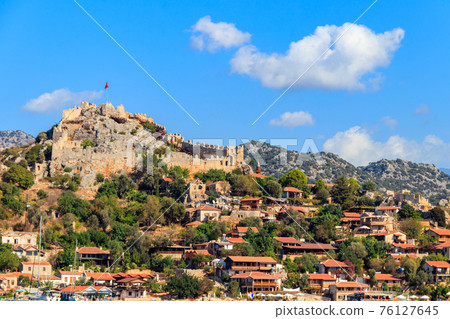 View of ancient Lycian town Simena with fortress on a mount on the coast of the Mediterranean sea in Antalya Province, Turkey View of ancient Lycian town Simena with fortress on a mount on the coast of the Mediterranean sea in Antalya Province, Turkey 76127645