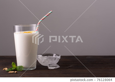 Lassi is a popular traditional dahi, yogurt based cold drink 76128064