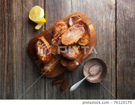 Traditional Spanish torrijas. Dessert for Christmas time or Pascua in Spain Traditional Spanish torrijas. Dessert for Christmas time or Pascua in Spain 76128170