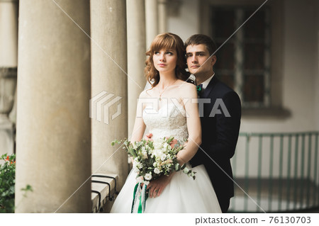Luxury married wedding couple, bride and groom posing in old city Luxury married wedding couple, bride and groom posing in old city 76130703