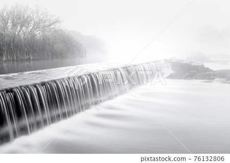 Mornig fog over a river dam Mornig fog over a river dam 76132806