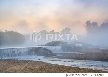 Mornig fog over a river diversion dam Mornig fog over a river diversion dam 76132809