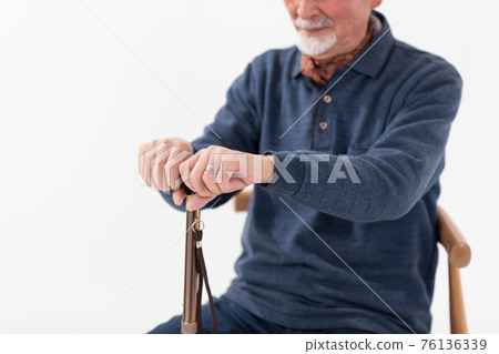 Senior man wand at hand Senior man wand at hand 76136339