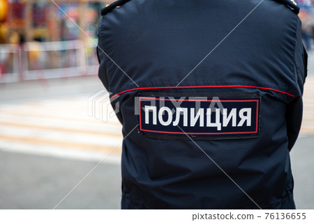 Russia Kemerovo 2019-05-10 Police employee in uniform patrolling public event 76136655