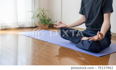 Image of a man doing yoga and meditation at home 76137662
