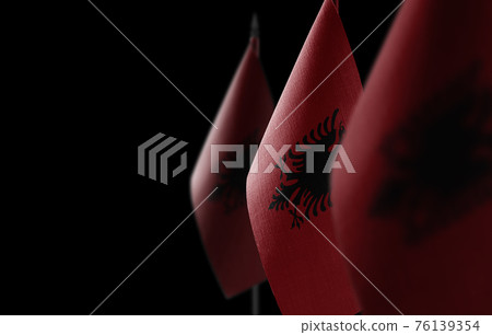 Small national flags of the Albania on a black background 76139354