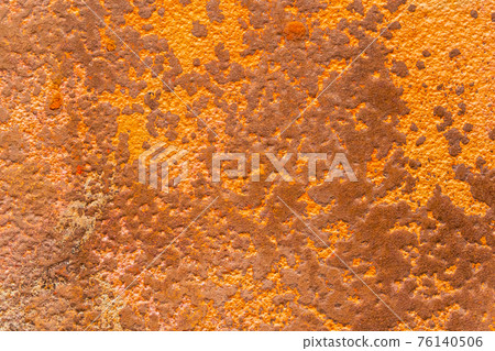 Textured rusty surface close-up. Abstract spotted background Textured rusty surface close-up. Abstract spotted background 76140506