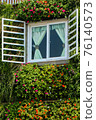 This is a photo taken through the window of a structure in Seoul National University Park. 76140573