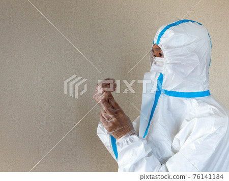 Infectious disease countermeasures Image of a man wearing protective clothing 76141184