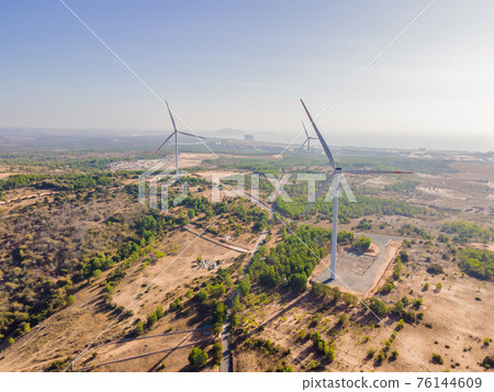 Wind turbine from aerial view - Sustainable development, environment friendly, renewable energy concept Wind turbine from aerial view - Sustainable development, environment friendly, renewable energy concept 76144609