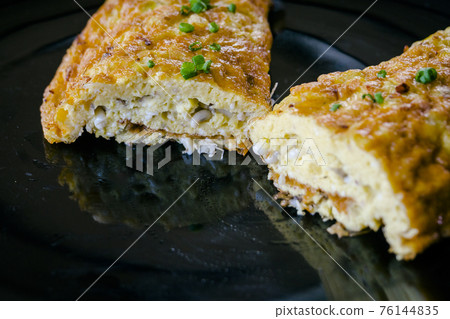 Closeup of Omelet with red ant eggs 76144835