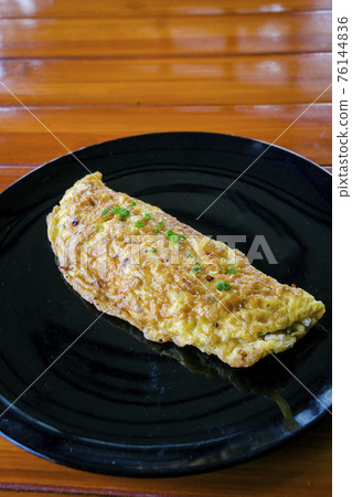 Closeup of Omelet with red ant eggs 76144836