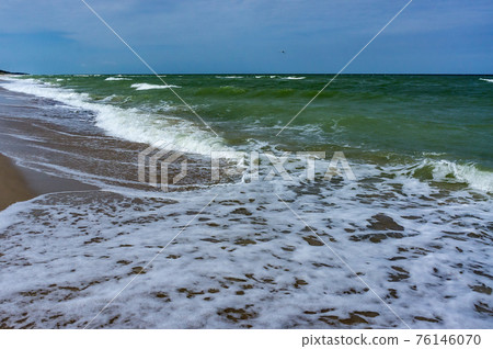 ships on the sea horizon, Baltic sea coast, small waves on the sea 76146070