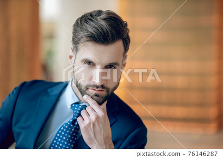 Picture of a handsome man in a nice blue suit and tie Picture of a handsome man in a nice blue suit and tie 76146287
