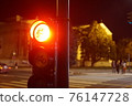 Red traffic light for bicycle. Spot sign for bike lane at night 76147728