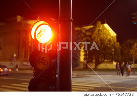 Red traffic light for bicycle. Spot sign for bike lane at night Red traffic light for bicycle. Spot sign for bike lane at night 76147728