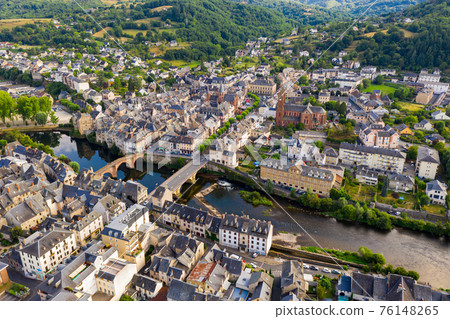 Flight over the city Espalion and river Lot on day. France Flight over the city Espalion and river Lot on day. France 76148265