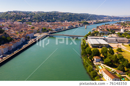 Aerial view of French commune of Vienne on banks of Rhone river 76148350