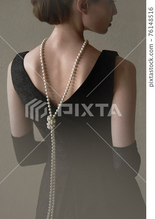 Historic fashion woman in a beautiful dress and beads 76148516