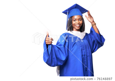 Black woman in a blue robe on a white background smiles and shows thumb up Black woman in a blue robe on a white background smiles and shows thumb up 76148897