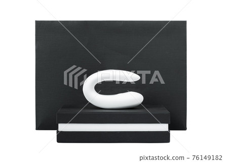 clitoral vaginal vibrator silicone on a black box intimate gift sex toy for a couple, erotic object for adults in a stylish package isolated on a white background, nobody. clitoral vaginal vibrator silicone on a black box intimate gift sex toy for a couple, erotic object for adults in a stylish package isolated on a white background, nobody. 76149182