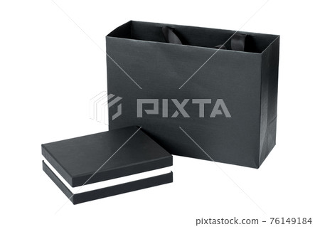 closed cardboard box and a package of design paper black mockup stylish packaging for expensive gifts isolated objects on a white background. closed cardboard box and a package of design paper black mockup stylish packaging for expensive gifts isolated objects on a white background. 76149184