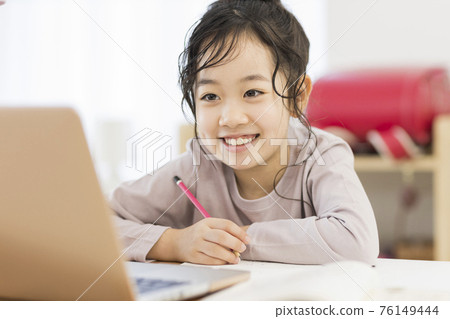 Girls studying while looking at a computer Online class Girls studying while looking at a computer Online class 76149444