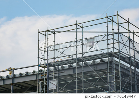 Steel frames and temporary scaffolding at a construction site 76149447