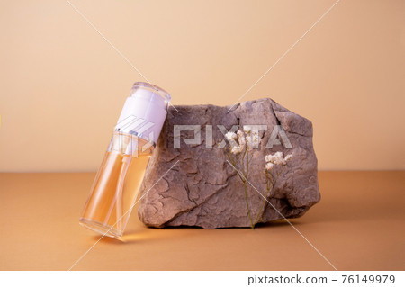 Cosmetics bottle with gel or other cosmetic product, stones, dried plant flowers Cosmetics bottle with gel or other cosmetic product, stones, dried plant flowers 76149979