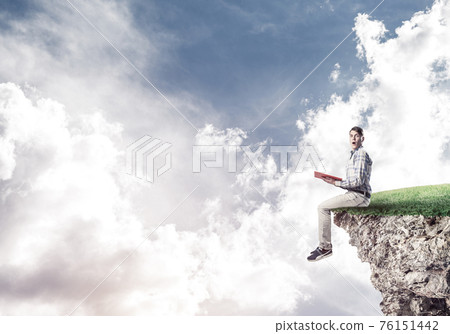 Student guy with book in hands preparing for exam Student guy with book in hands preparing for exam 76151442