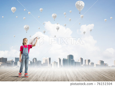 Concept of careless happy childhood with girl dreaming about something Concept of careless happy childhood with girl dreaming about something 76151504