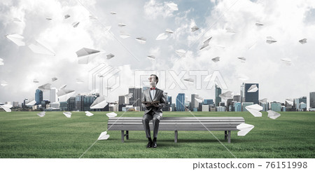 Young businessman or student studying the science and paper plan Young businessman or student studying the science and paper plan 76151998