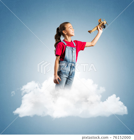 Concept of careless happy childhood with girl dreaming to become pilot Concept of careless happy childhood with girl dreaming to become pilot 76152000