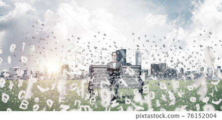 Young businessman or student studying the science and symbols fl Young businessman or student studying the science and symbols fl 76152004