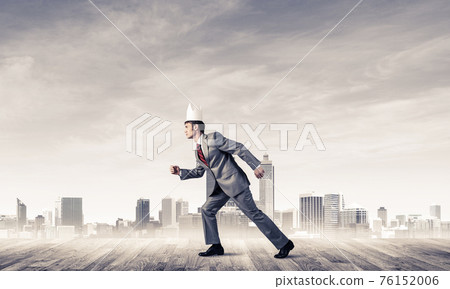 King businessman in elegant suit running and modern cityscape at King businessman in elegant suit running and modern cityscape at 76152006