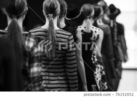 Fashion Show, Catwalk Runway Event, Fashion Week themed photograph. Models walking fashion show finale. 76152052
