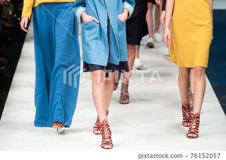 Fashion Show, Catwalk Runway Event, Fashion Week themed photograph. Models walking fashion show finale. 76152057