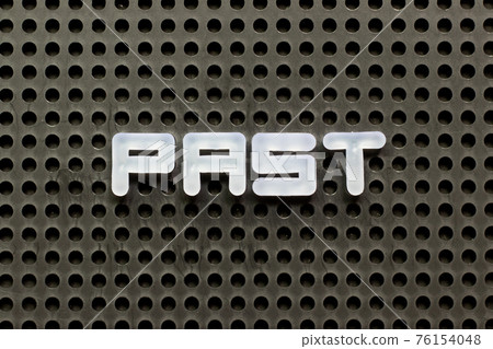 White color letter in word past on black pegboard background White color letter in word past on black pegboard background 76154048