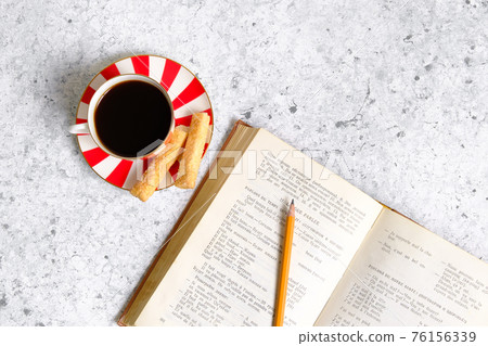 Coffee in a cup, cookies and a book Coffee in a cup, cookies and a book 76156339