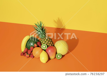 Tropical fruits isolated on a colored background. Fresh summer fruits. 76158297