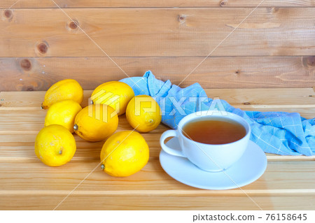 cup of tea with fresh lemon and ginger, top view. 76158645